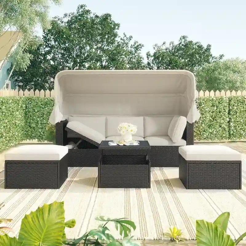 Lit de repos rectangulaire pour terrasse extérieure avec auvent rétractable et coussins