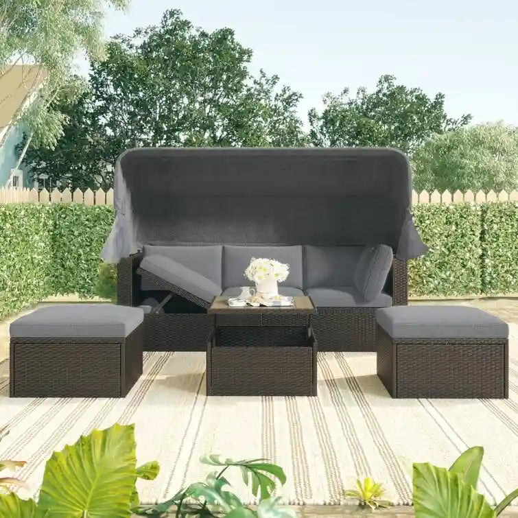 Lit de repos rectangulaire pour terrasse extérieure avec auvent rétractable et coussins