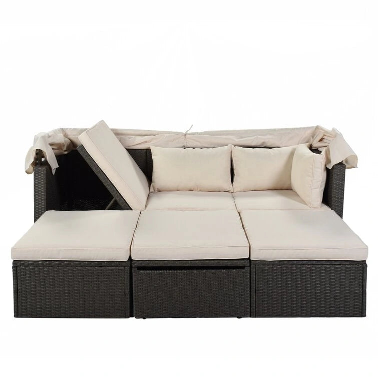 Lit de repos rectangulaire pour terrasse extérieure avec auvent rétractable et coussins
