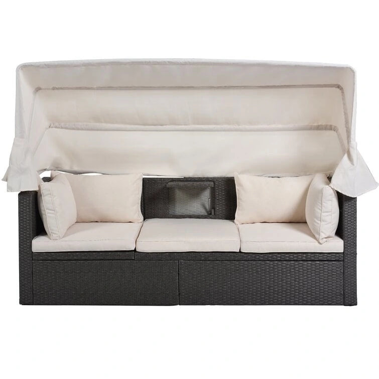 Lit de repos rectangulaire pour terrasse extérieure avec auvent rétractable et coussins
