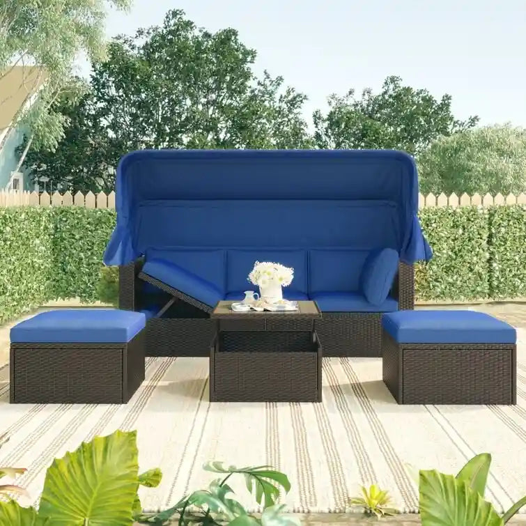 Lit de repos rectangulaire pour terrasse extérieure avec auvent rétractable et coussins