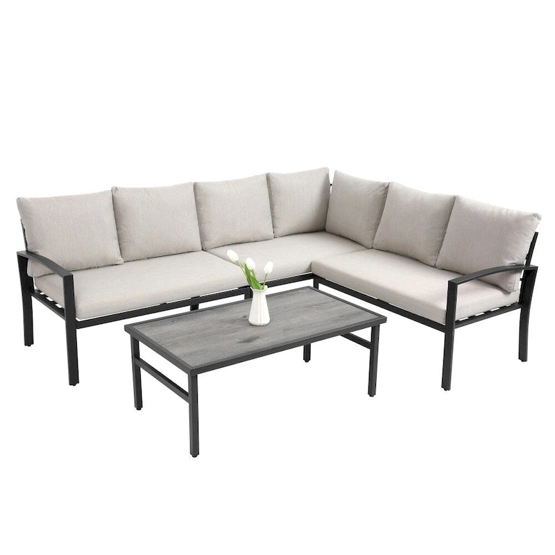 Ensemble de mobilier de patio en acier 4 pièces avec coussins beiges et table basse